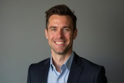 Professional headshot of a smiling person